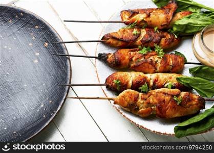 Tasty chicken meat, chicken breast roasted on wooden skewers. Kebabs. Chicken skewers, barbecue meat