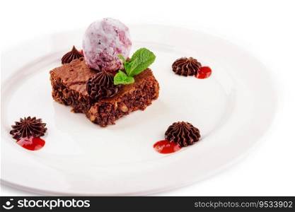 Tasty chocolate brownie with blueberry ice cream
