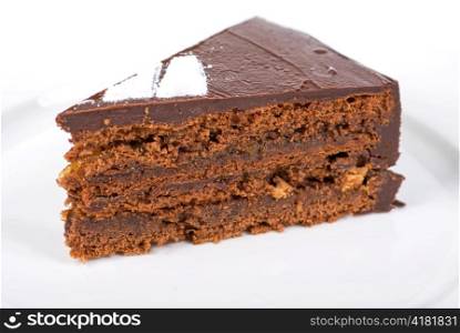 Tasty chocolate cake on a plate closeup