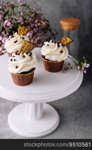 Tasty chocolate cupcakes with whipped cream