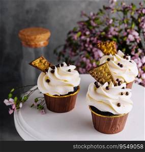 Tasty chocolate cupcakes with whipped cream