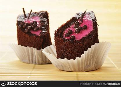 tasty chocolate sacher cakes close-up isolated