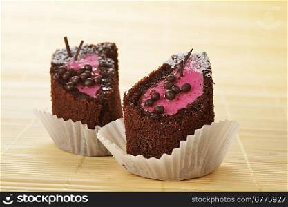 tasty chocolate sacher cakes close-up isolated