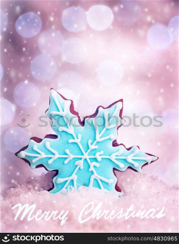 Tasty Christmas cookie, snowflake shape homemade gingerbread with blue sugar topping, festive greeting card with best wishes