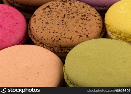 Tasty colorful macaroon close up for background