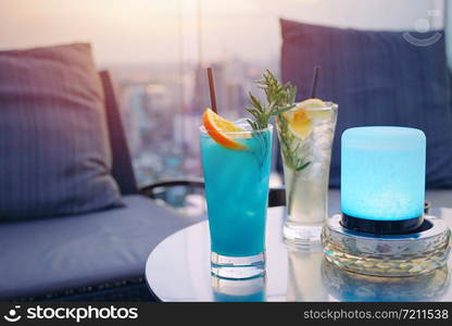 Tasty colorful summer cocktail for couple on rooftop bar date night, luxury and romantic concept