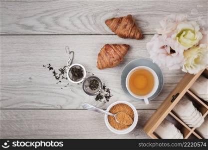 tasty croissants wooden background