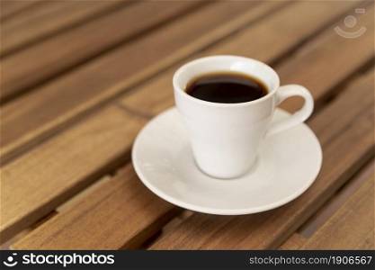 tasty cup black coffee wooden table. High resolution photo. tasty cup black coffee wooden table. High quality photo