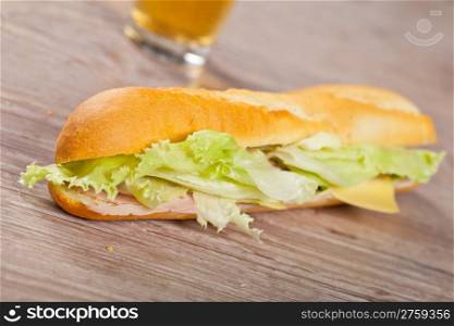 Tasty delicious sandwich with ham and cheese