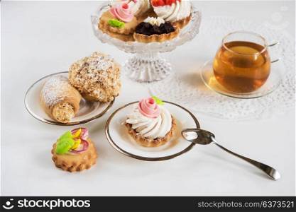 Tasty different cakes. Tasty different cakes set with on a white background