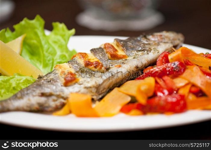 Tasty dish of rainbow trout fish with vegetables