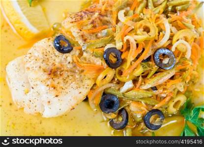 Tasty fish pike perch with mix of vegetables