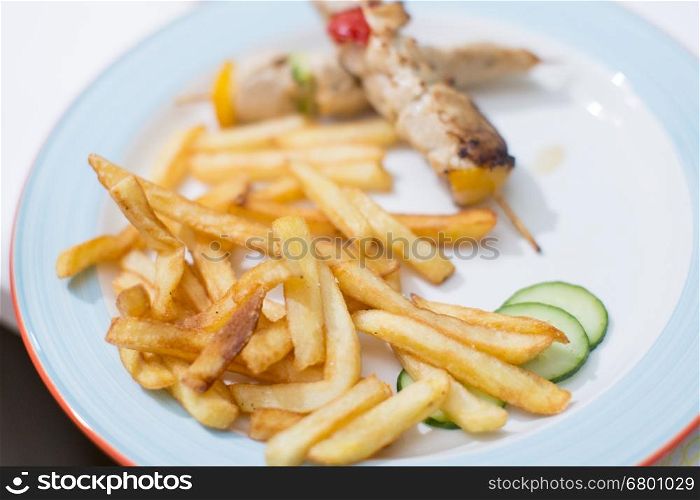 Tasty french fries with barbecue on child birthday party