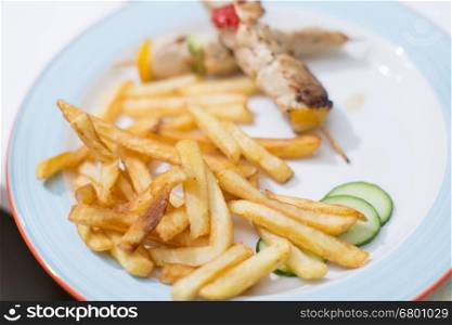 Tasty french fries with barbecue on child birthday party