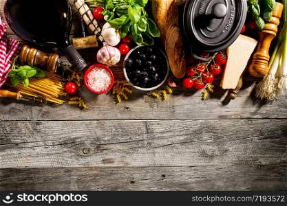 Tasty fresh appetizing italian food ingredients on old rustic wooden background. Ready to cook. Home Italian Healthy Food Cooking Concept.