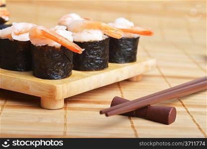 tasty fresh sushi cone on wooden plate