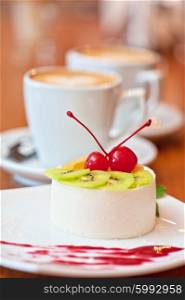 tasty fruit dessert with cherry and kiwi. tasty fruit dessert with cherry and kiwi with coffee