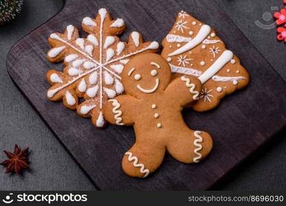 Tasty gingerbread homemade for decorating the festive table for the Christmas holiday. Decorations and home preparation for Christmas. Tasty gingerbread homemade for decorating the festive table for the Christmas holiday