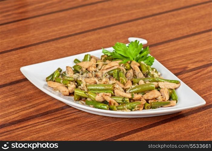 Tasty green beans with chicken meat
