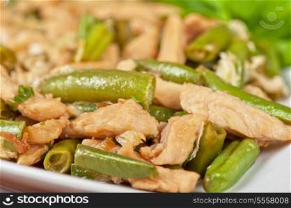 Tasty green beans with chicken meat