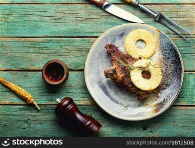 Tasty grilled beef meat with pineapple in pineapple sauce. Copy space. Roasted meat chop in marinade, space for text