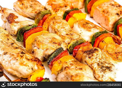 Tasty grilled meat on a white background, shish kebab