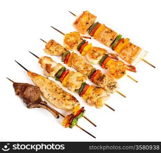 Tasty grilled meat on a white background, shish kebab