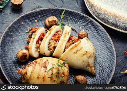 Tasty grilled squids with vegetable stuffing. Stuffed calamari. Seafood, mediterranean food. Stuffed calamari squid