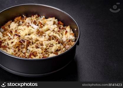 Tasty healthy dish of cauliflower and beef mince baked with lactose-free cheese as well as spices and herbs. Tasty healthy dish of cauliflower and beef mince baked with lactose-free cheese