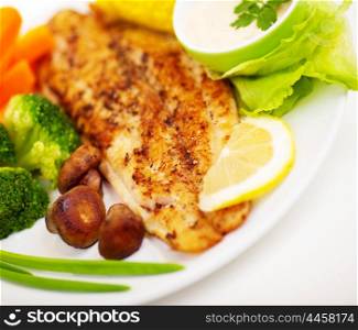 Tasty healthy fish fillet with steamed vegetables, healthy nutrition, dinner in restaurant, delicious meal
