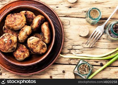 tasty homemade cutlets. Flat lay homemade cutlets in clay ware on plate