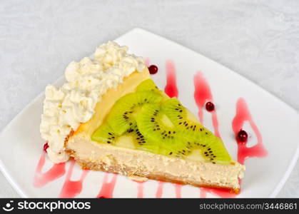 tasty kiwi fresh cake closeup at plate