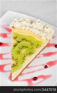tasty kiwi fresh cake closeup at plate
