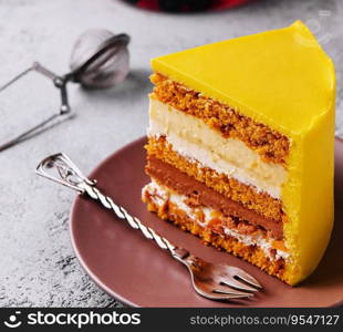 Tasty mango mousse cake on plate