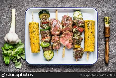 Tasty meat, vegetables and corn skewers in herbs marinate with fresh seasoning and Basting Brush for grilling, top view