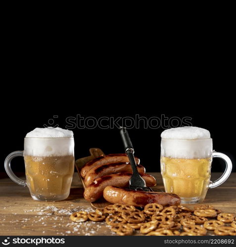 tasty mugs beer with sausages table