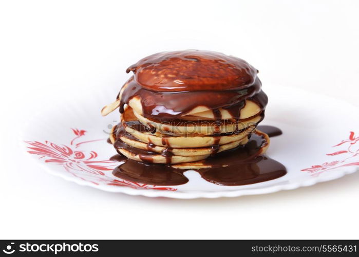 tasty pancakes with chocolate syrup