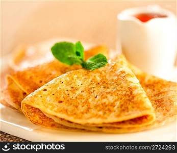 Tasty pancakes with sauce, breakfast