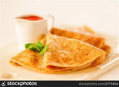 Tasty pancakes with sauce, breakfast