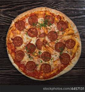 Tasty pepperoni pizza. Pepperoni pizza on wooden table