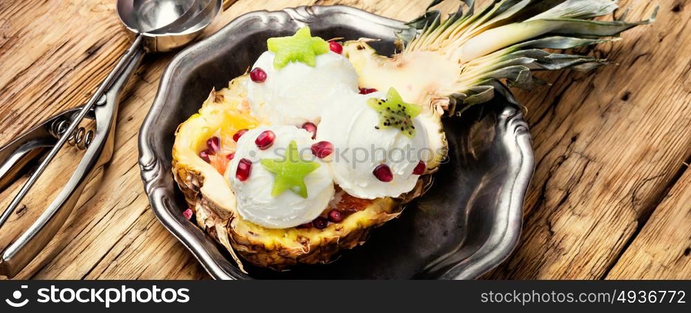 Tasty pineapple vanilla. Ice cream in a pineapple bowl.Organic vanilla ice cream