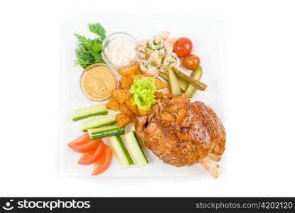 Tasty pork dish with vegetables on a white background