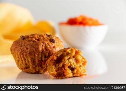 Tasty pumpkin muffins on a white background. Trendy food, vegetable baking. Homemade cakes for a healthy diet.. Pumpkin muffins on a white background. Trendy food, vegetable baking. Homemade cakes for a healthy diet.