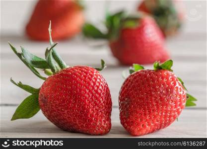 Tasty red strawberries on a wooden table