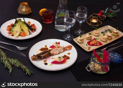 Tasty restaurant dishes: Cooked and stuffed crayfish, salad, appetizers, and crayfish ice-cream. Tasty restaurant dishes