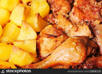 Tasty roast chicken with potato close up