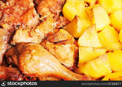 Tasty roast chicken with potato close up