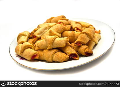 Tasty rolls on plate. On white background