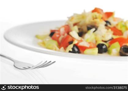 Tasty salad from vegetables on white plate