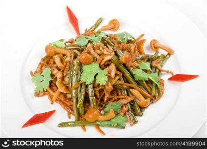 Tasty salad of mushrooms and vegetable dish close up on a white background